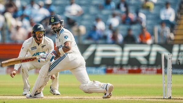 <div class="paragraphs"><p>India's Virat Kohli being bowled by New Zealand's Mitchell Santner on the second day of the second test cricket match between India and New Zealand, at the Maharashtra Cricket Association Stadium, in Pune.</p></div>