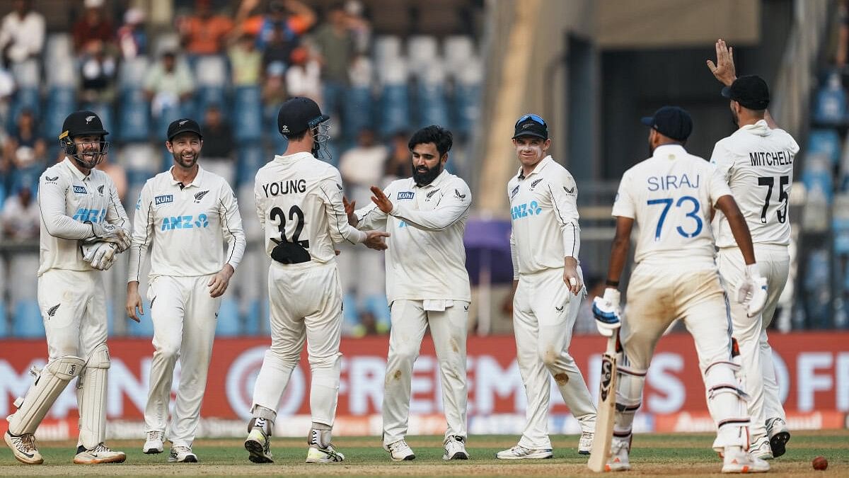 <div class="paragraphs"><p>New Zealand's Ajaz Patel celebrates with teammates after taking the wicket of India's Mohammed Siraj on the first day of the third test cricket match between India and New Zealand, at the Wankhede Stadium, in Mumbai, Friday, Nov. 1, 2024.</p></div>