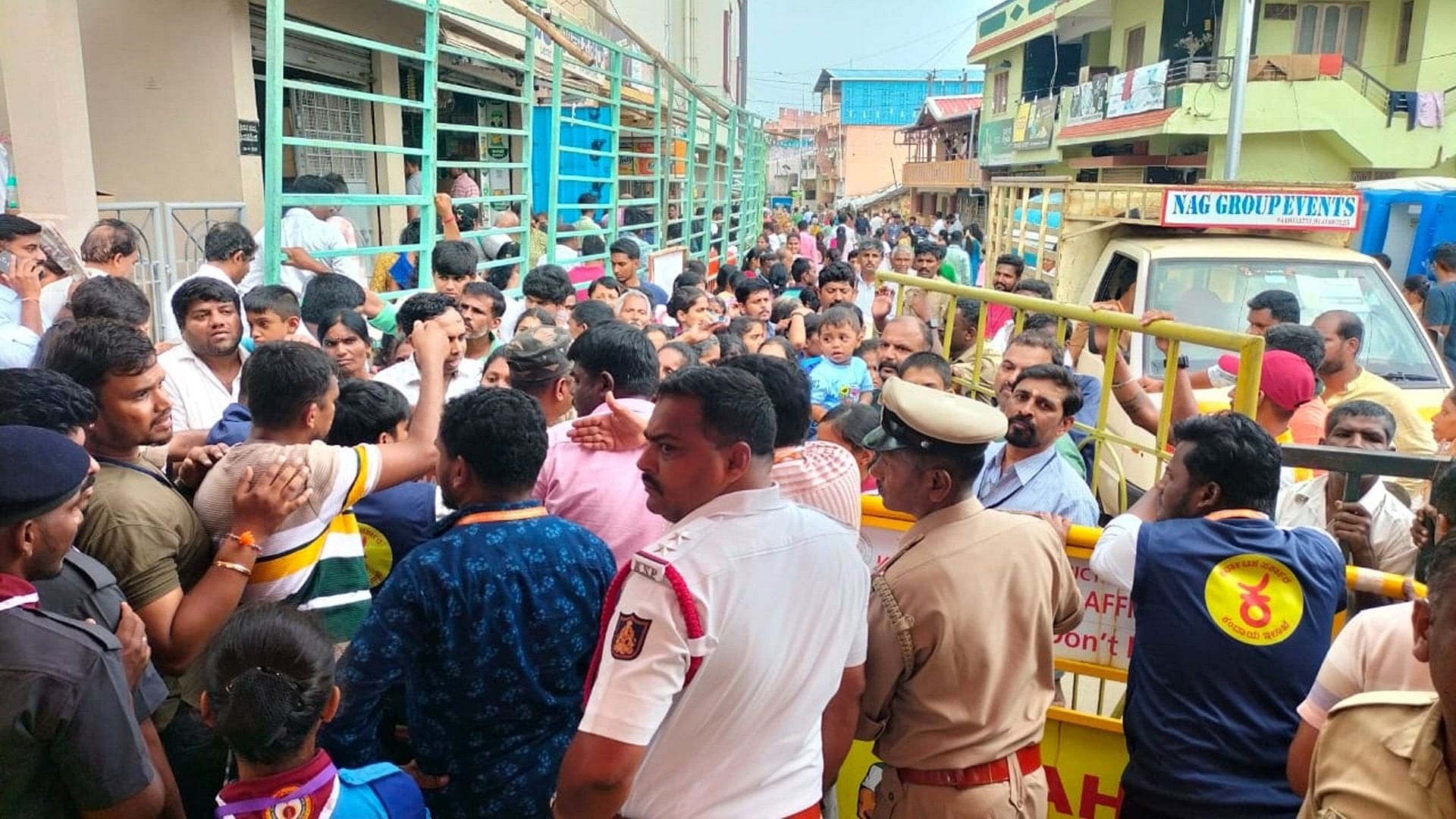 <div class="paragraphs"><p>Devotees try to enter the temple, damaging the barricade, at the Hasanamba temple in Hassan on Thursday. </p></div>