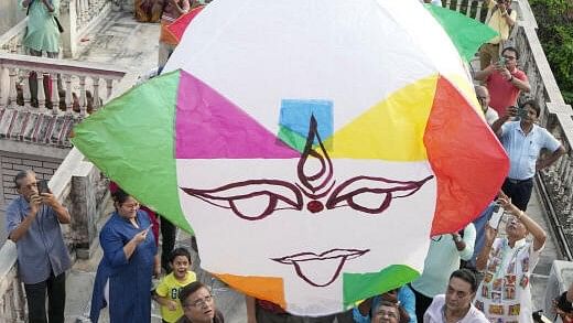 <div class="paragraphs"><p>People release a hot air ballon during Kali Puja celebration, in Kolkata.</p></div>