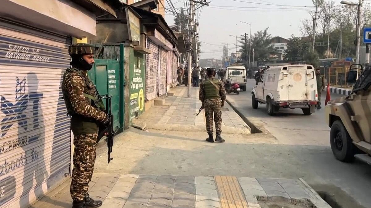 <div class="paragraphs"><p> Security personnel stand guard during a cordon and search operation after reports of movement of terrorists in the Khanyar area, in Srinagar, Saturday, Nov 2, 2024.</p></div>