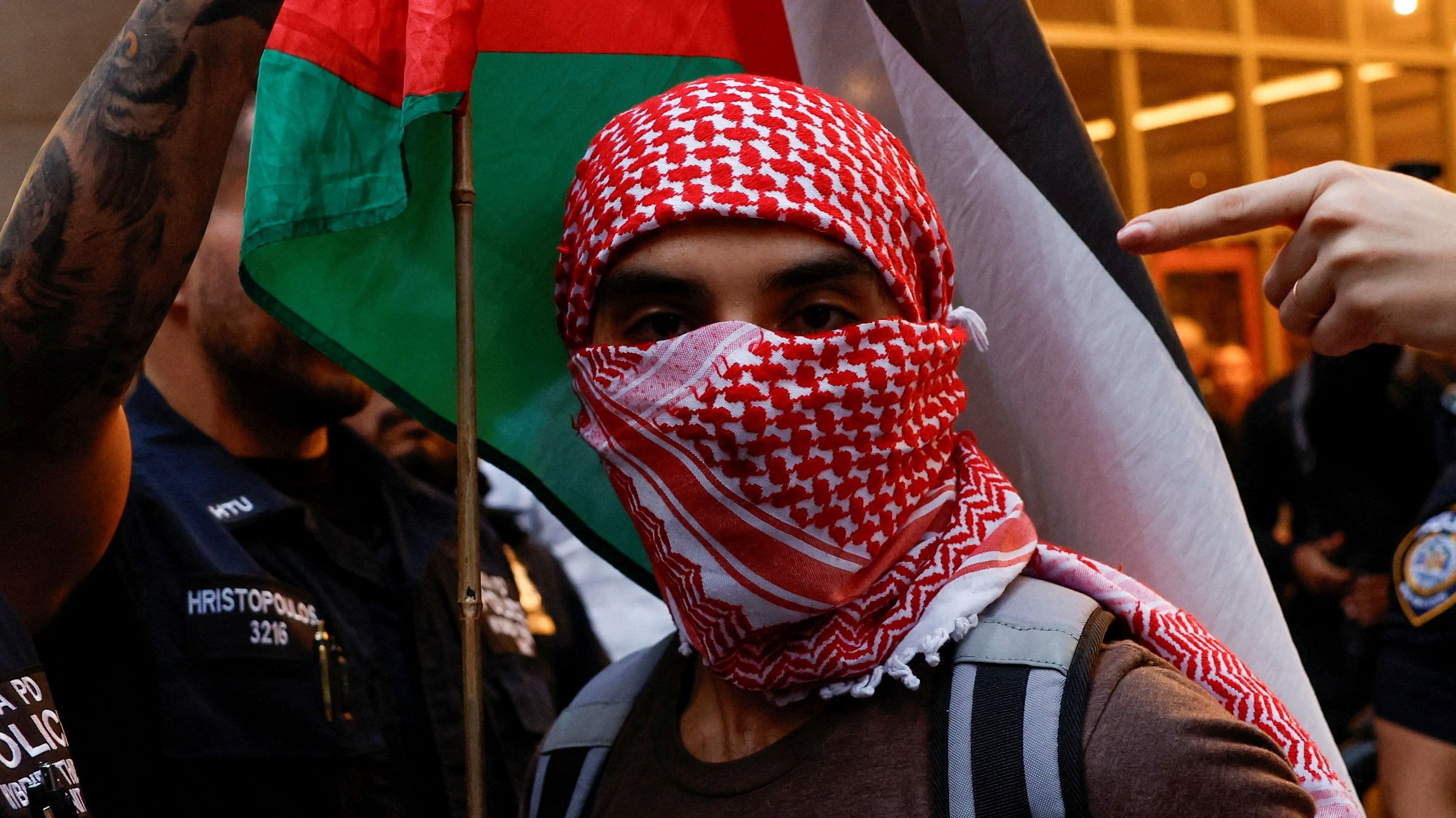 <div class="paragraphs"><p>A Pro-Palestinian protester takes part in a rally against Israel's strikes on Gaza and Lebanon, in New York City, US.</p></div>