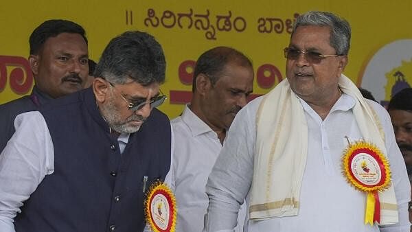 <div class="paragraphs"><p>Karnataka Chief Minister Siddaramaiah with his deputy D.K. Shivakumar during the celebrations of Karnataka state formation day 'Kannada Rajyotsava', at Sree Kanteerava Stadium, in Bengaluru, Friday, Nov. 1, 2024.</p></div>