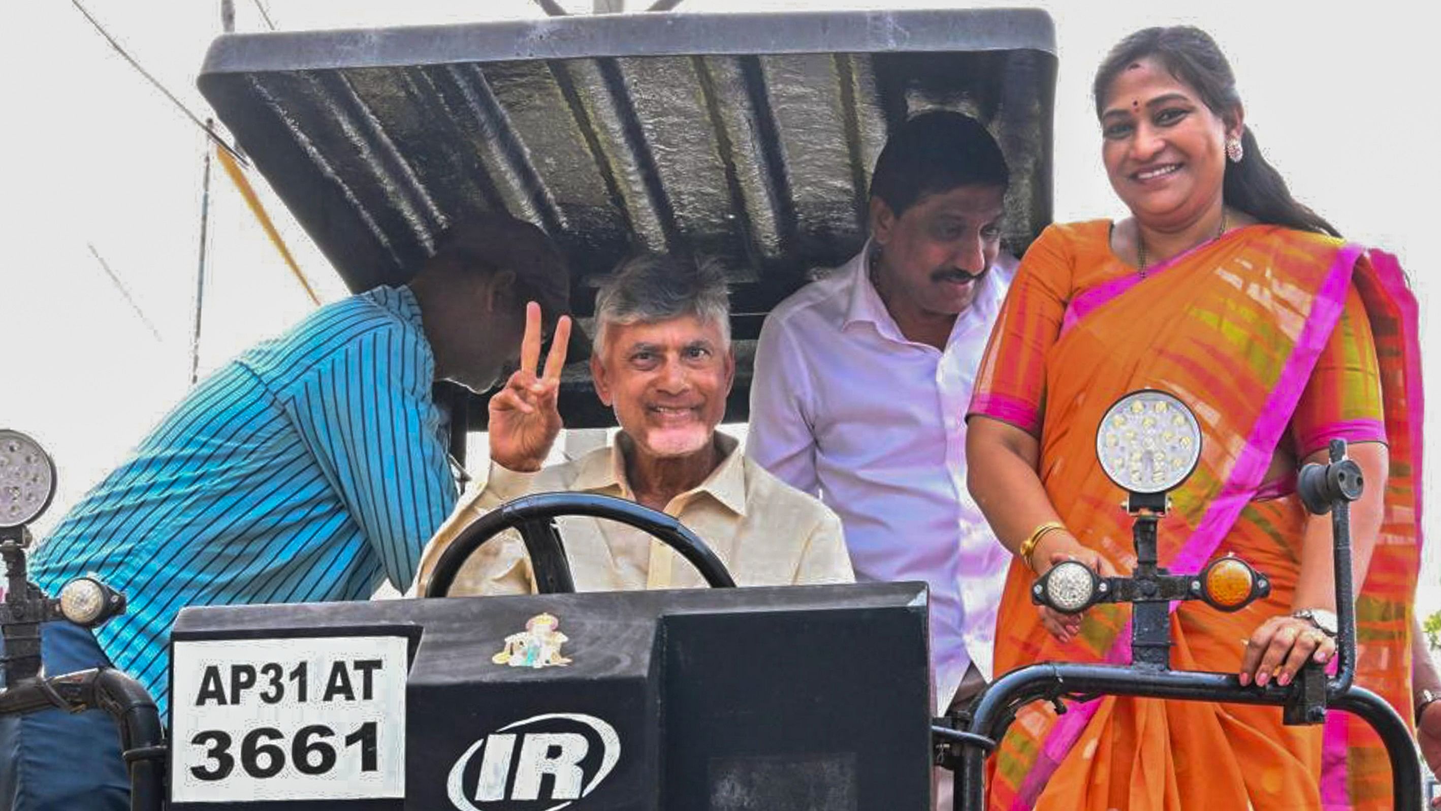 <div class="paragraphs"><p>Andhra Pradesh Chief Minister N Chandrababu Naidu rides a tractor during the launch of a mission to fill potholes of roads, in Anakapalli district.</p></div>