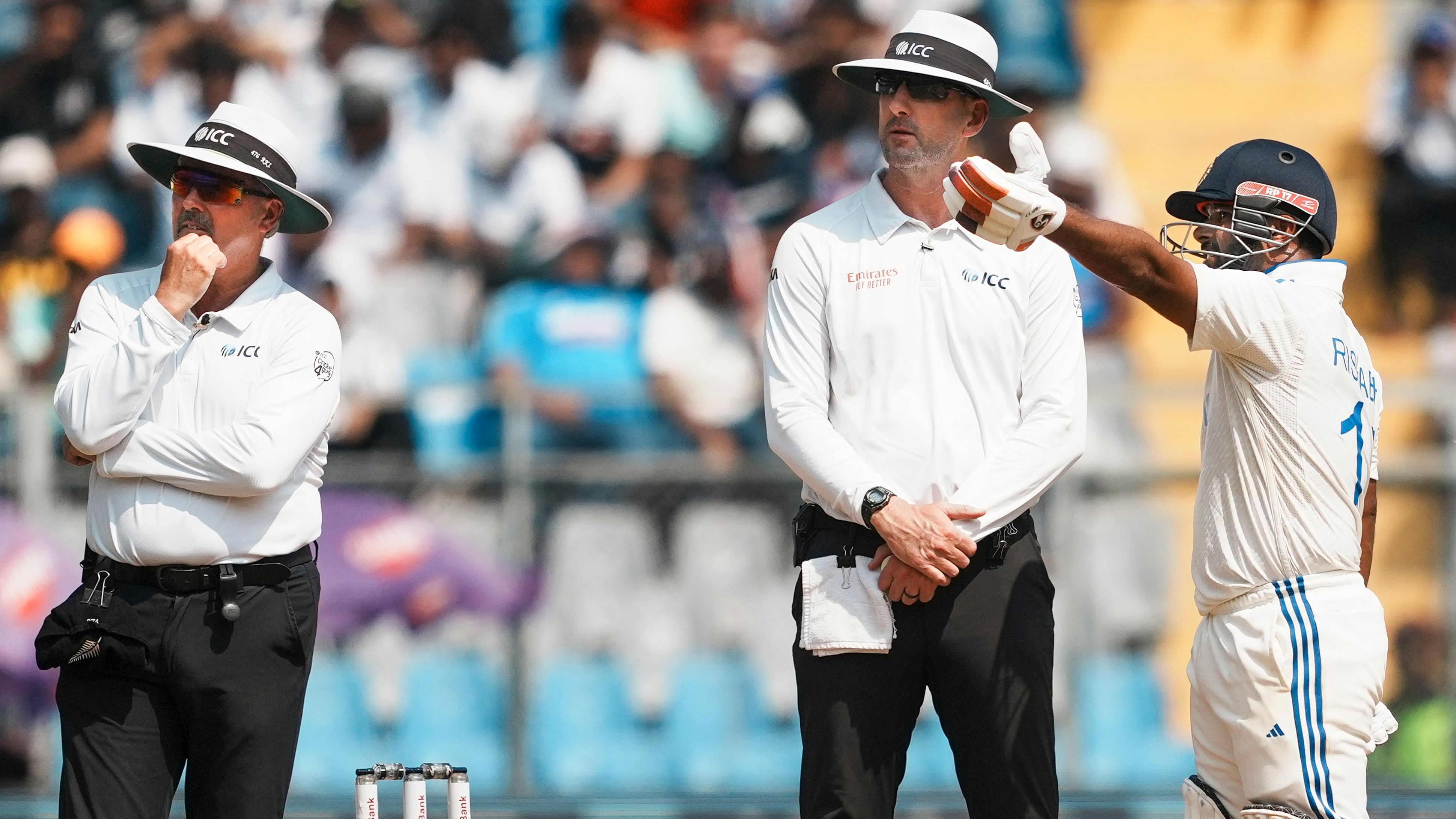 <div class="paragraphs"><p>India's Rishabh Pant (right) makes his displeasure evident to the on-field umpires after New Zealand asked for a DRS.</p></div>