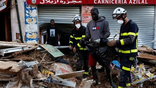 <div class="paragraphs"><p>Firefighters work, following heavy rains that caused floods, in Sedavi, Valencia, Spain.</p></div>