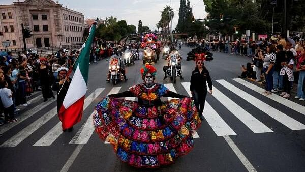 <div class="paragraphs"><p>A woman dressed as a Catrina takes part in the annual parade of Catrinas on the Day of the Dead, in Saltillo, Mexico.</p></div>