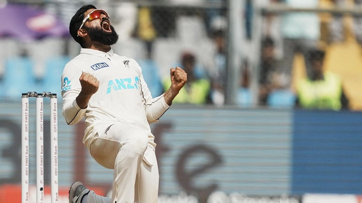 <div class="paragraphs"><p>Ajaz Patel elebrates after taking the wicket of Washington Sundar during day three of third Test cricket match between India and New Zealand at Wankhede Stadium, in Mumbai.</p></div>