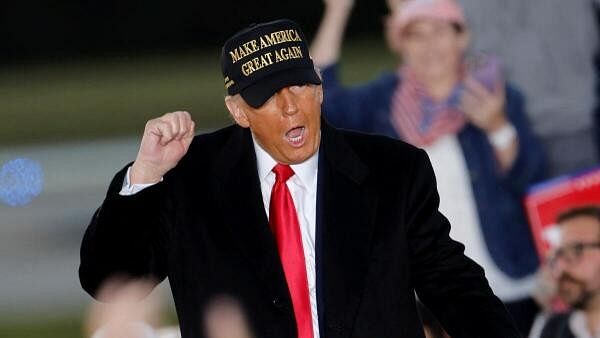 <div class="paragraphs"><p>Republican presidential nominee and former U.S. President Donald Trump gestures during his rally in Kinston, North Carolina, US.</p></div>