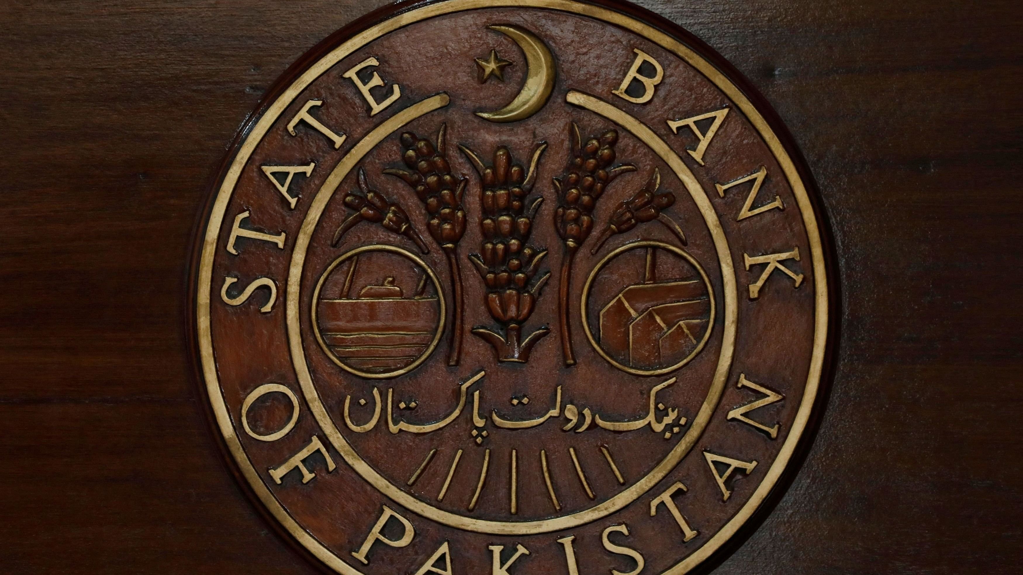 <div class="paragraphs"><p>Logo of the State Bank of Pakistan  is pictured on a reception desk at the head office in Karachi.&nbsp;</p></div>