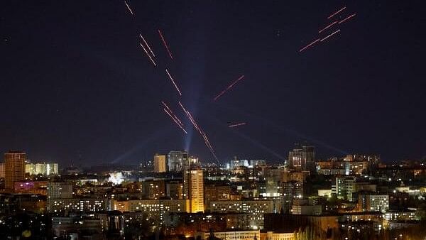 <div class="paragraphs"><p>Tracers and searchlights are seen in the night sky as Ukrainian servicemen search and fire at a drone during a Russian drone strike, amid Russia's attack on Ukraine, in Kyiv, Ukraine.</p></div>