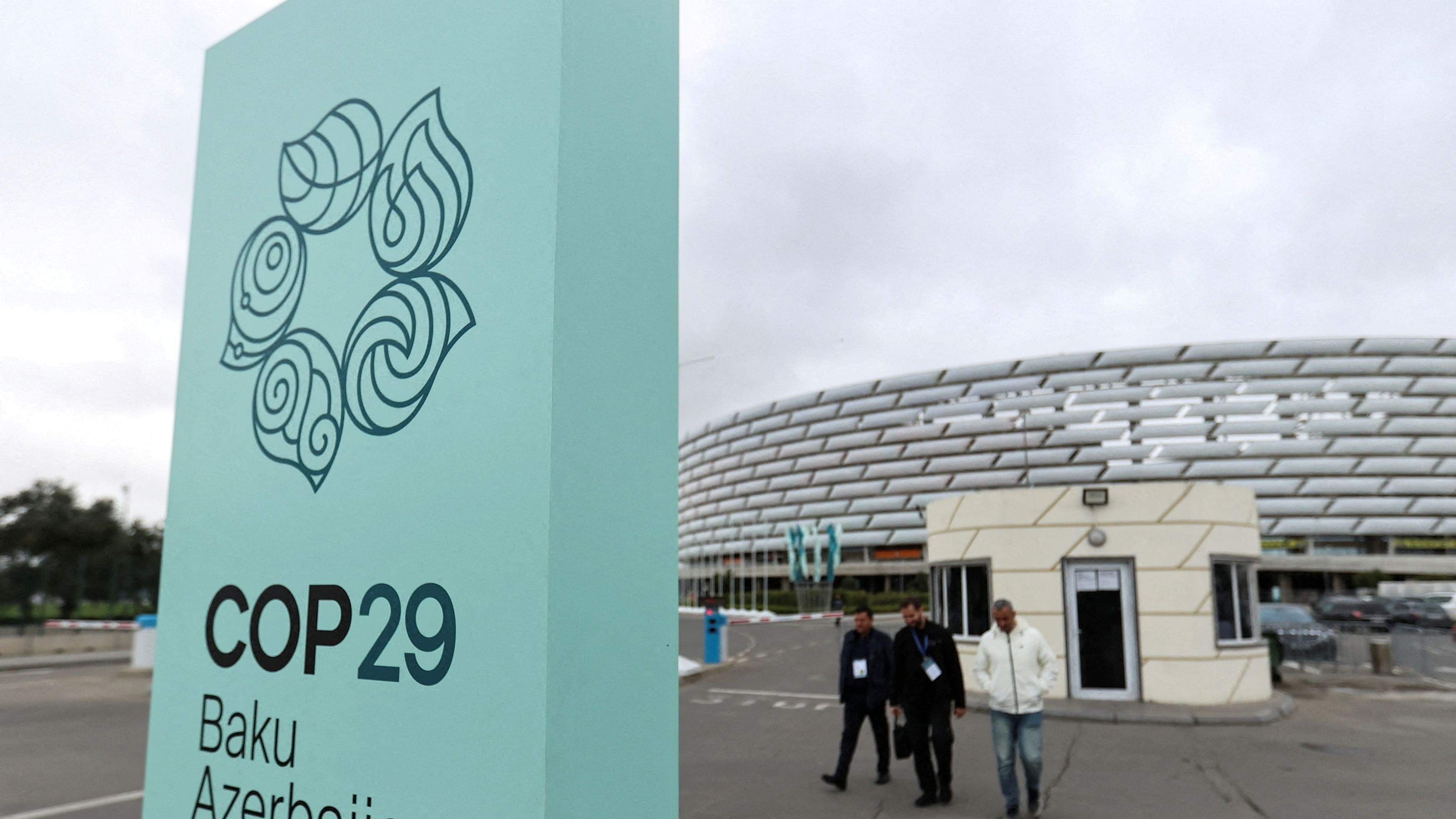 <div class="paragraphs"><p> People walk near the Baku Olympic Stadium, the venue of the COP29 United Nations Climate Change Conference, in Baku, Azerbaijan</p></div>