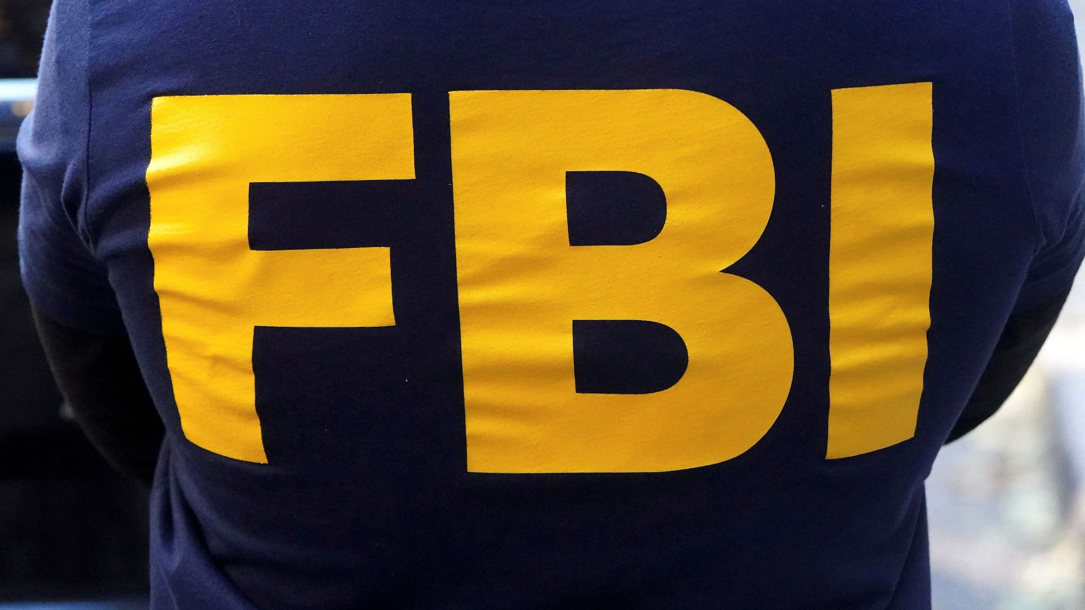 <div class="paragraphs"><p> An FBI logo is pictured on an agent's shirt in the Manhattan borough of New York City, New York, U.S. October 19, 2021.  </p></div>