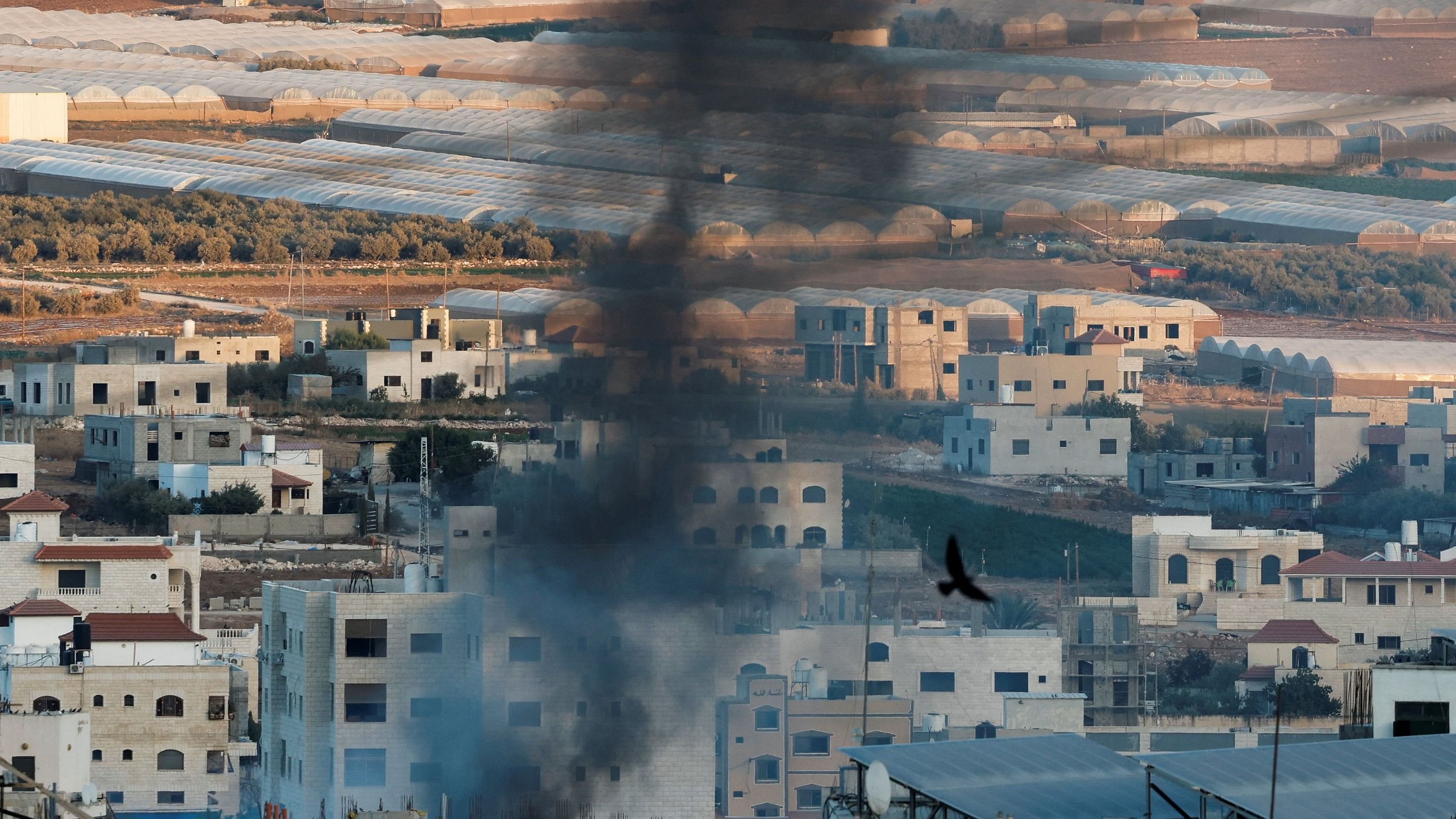 <div class="paragraphs"><p>Smoke rises from an explosion amid an Israeli raid in Tubas, in the Israeli-occupied West Bank.</p></div>