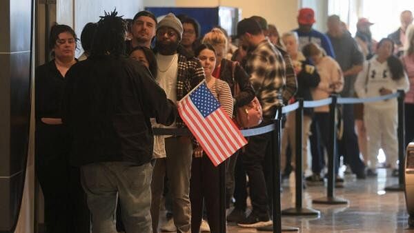 <div class="paragraphs"><p>People stand in line to vote the 2024 U.S. presidential election on Election Day at a polling station in Galleria at Sunset mall in Henderson, Nevada, US, November 5, 2024.</p></div>