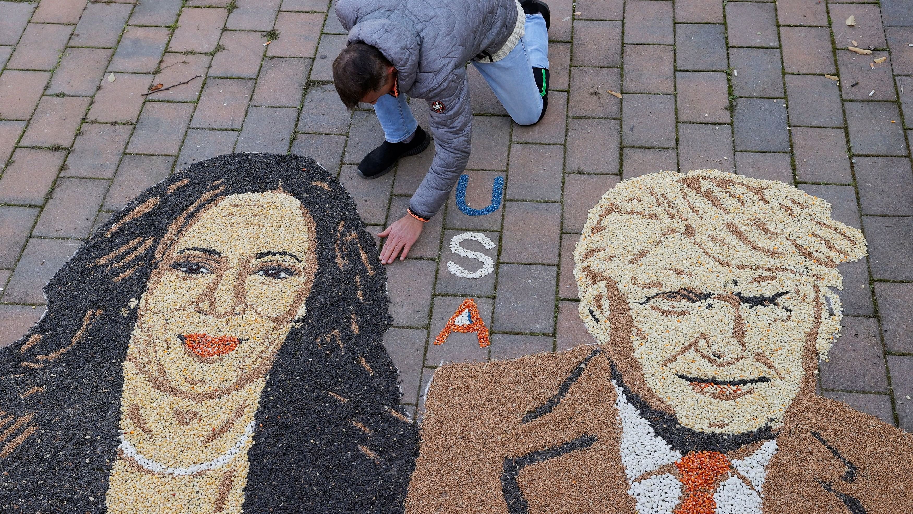 <div class="paragraphs"><p>Kosovo artist Alkent Pozhegu works on a mosaic made of grains showing portraits of Democratic presidential nominee U.S. Vice President Kamala Harris and Republican presidential nominee and former U.S. President Donald Trump, in Gjakova, Kosovo November 5, 2024. </p></div>