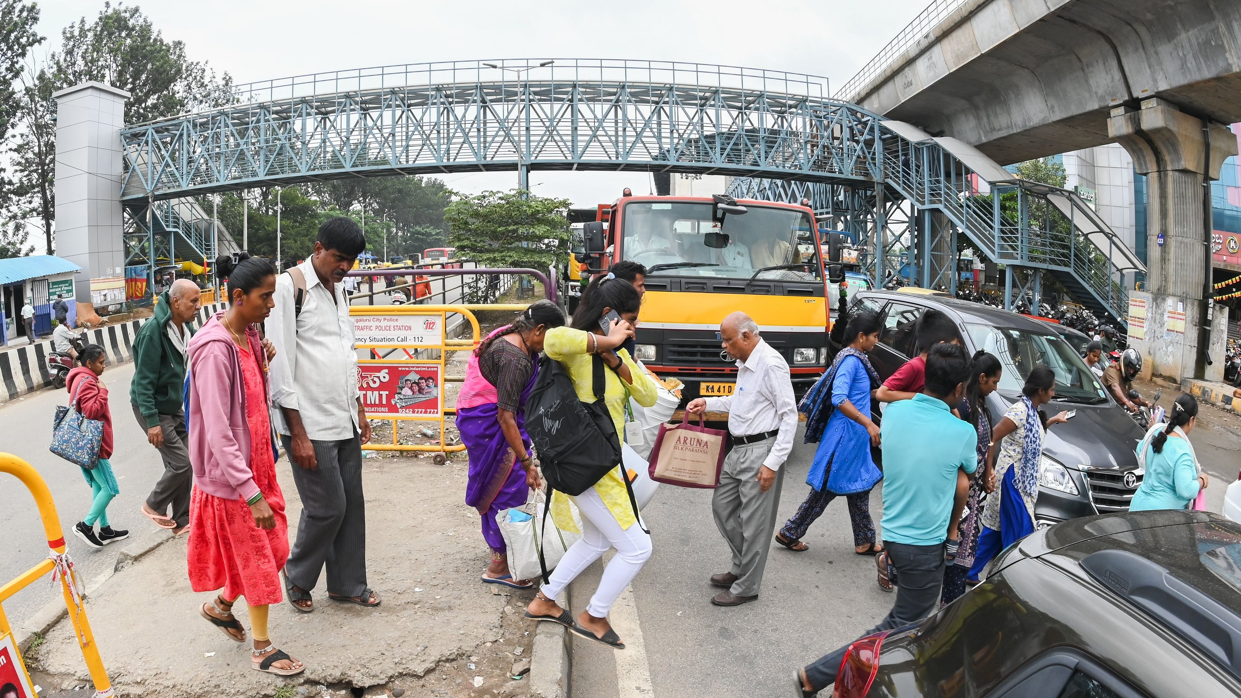 <div class="paragraphs"><p>Citizens say they are forced to cross the busy Mysuru Road because the skywalk has steep stairs, lacks a lift, and is generally unclean. </p></div>