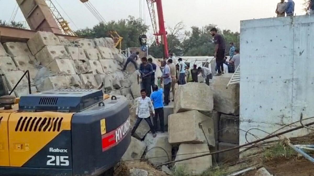 <div class="paragraphs"><p>Rescue operation underway after a temporary structure collapsed at a construction site in Gujarat's Anand.</p></div>