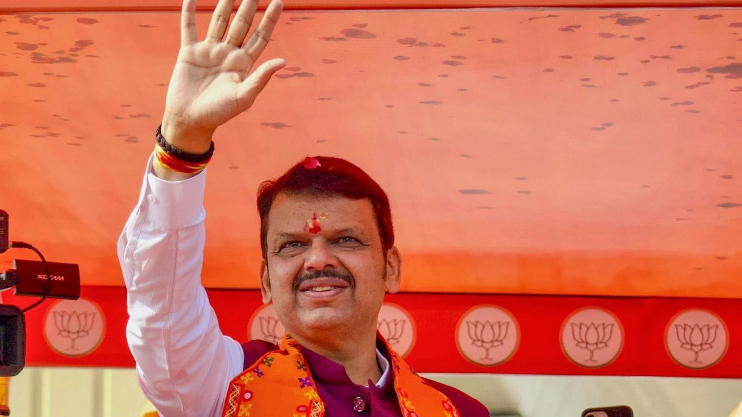 <div class="paragraphs"><p> Maharashtra Deputy Chief Minister and BJP candidate Devendra Fadnavis during a rally ahead of the state Assembly elections, in South-West Nagpur, Maharashtra.</p></div>