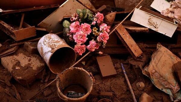 <div class="paragraphs"><p>Plastic flowers are pictured amidst mud in the aftermath of floods caused by heavy rains, as over 89 people are missing, the regional judicial authorities in Valencia said, in Paiporta, near Valencia, Spain.</p></div>