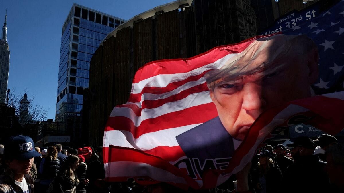 <div class="paragraphs"><p>Pedestrians walk by as people wait in line outside of Madison Square Garden to attend a rally for Republican presidential nominee and former US President Donald Trump in New York City.</p></div>