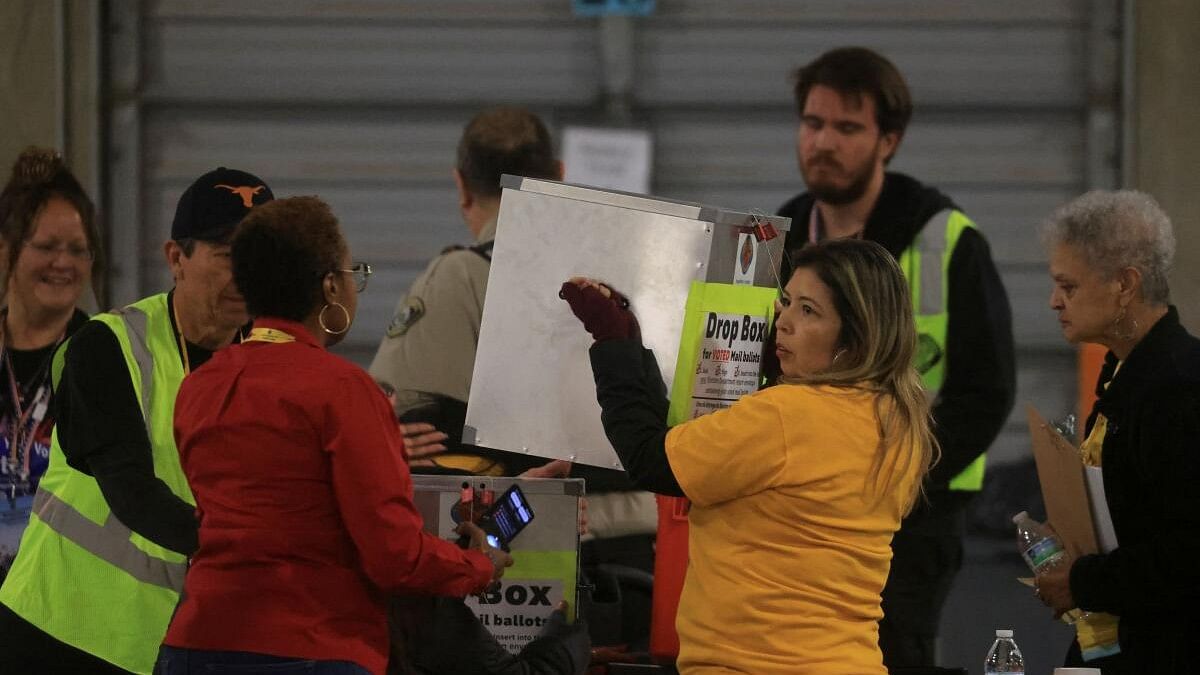 <div class="paragraphs"><p>An election official carries a ballot box at the Clark County Election Department during the 2024 U.S. presidential election on Election Day in Las Vegas, Nevada, U.S., November 5, 2024.</p></div>