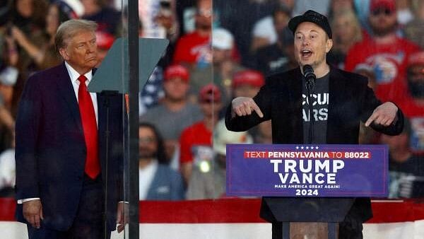 <div class="paragraphs"><p>Tesla CEO and X owner Elon Musk speaks as Republican presidential nominee and former US president Donald Trump looks on during a rally</p></div>