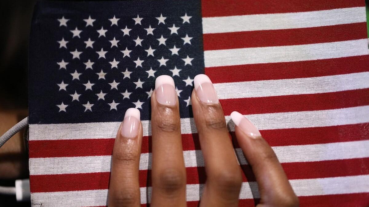 <div class="paragraphs"><p>A person holds an American flag-themed phone.</p></div>