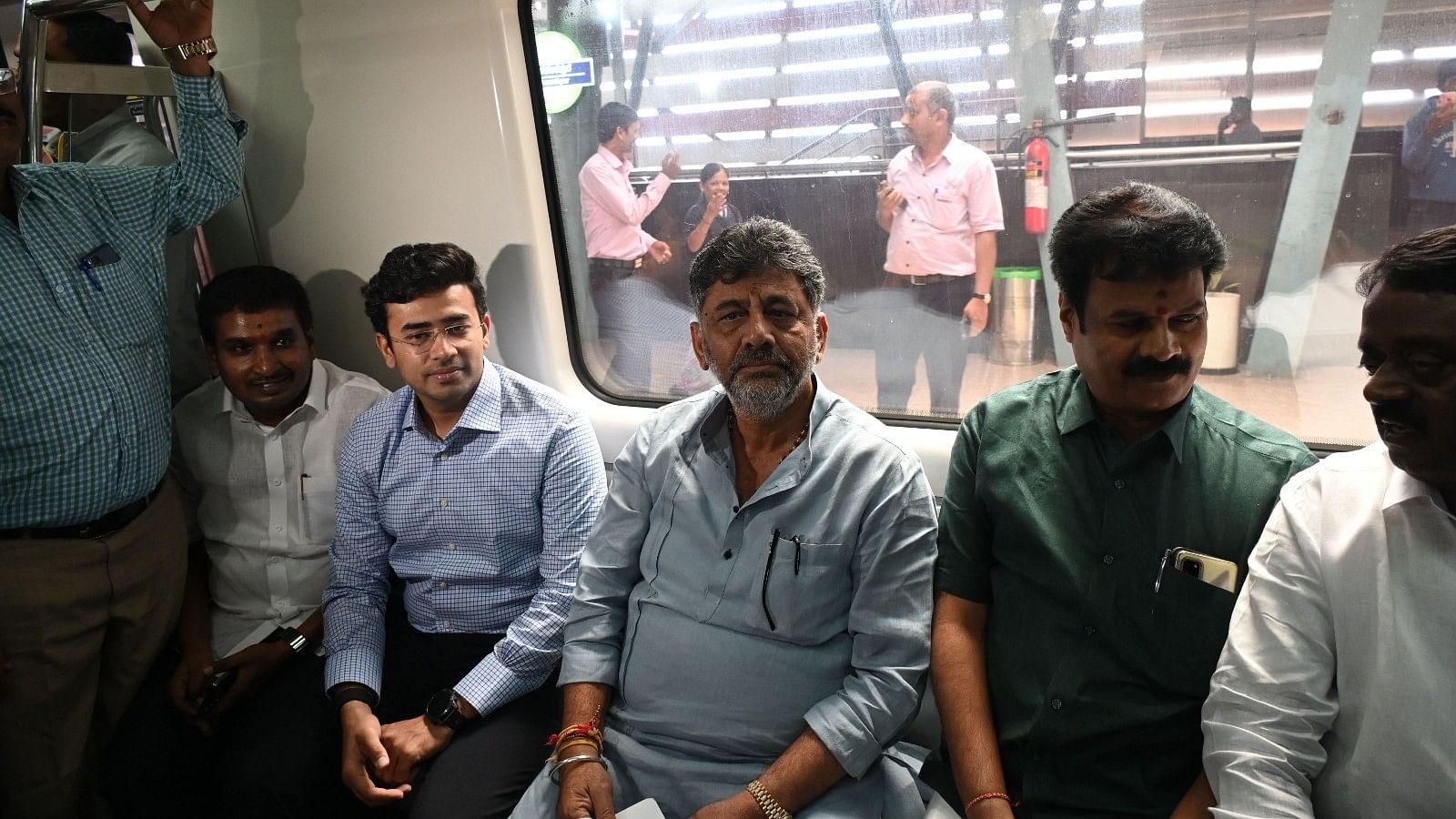 <div class="paragraphs"><p>Deputy Chief Minister DK Shivakumar travels on the metro train to Madavara, Tumakuru Road, in Bengaluru on Wednesday. Bangalore South MP L S Tejasvi Surya, MLAs Shreenivasaiah N (Nelamangala), S Muniraju (Dasarahalli) and others were present. </p></div>