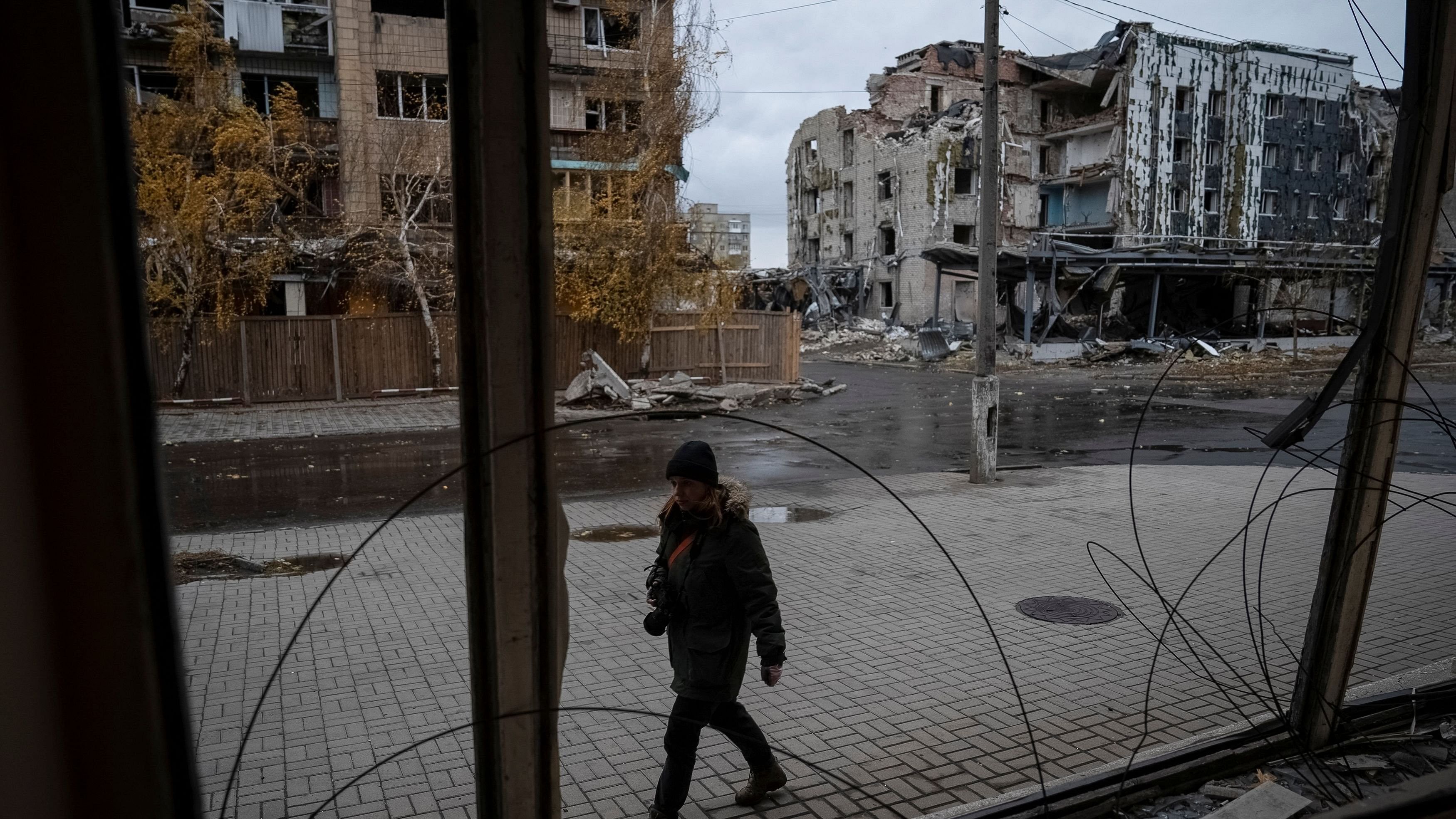 <div class="paragraphs"><p>A photographer walks past buildings damaged by a Russian military strike, amid Russia's attack on Ukraine, in the town of Pokrovsk in Donetsk region, Ukraine.</p></div>