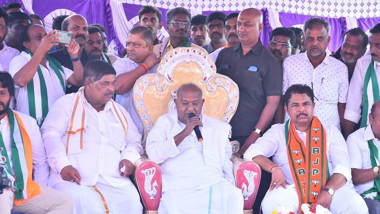 Former prime minister and JD(S) supremo H D Deve Gowda addresses an election rally for Channapatna bypolls on Tuesday. Leader of Opposition R Ashoka is also seen.