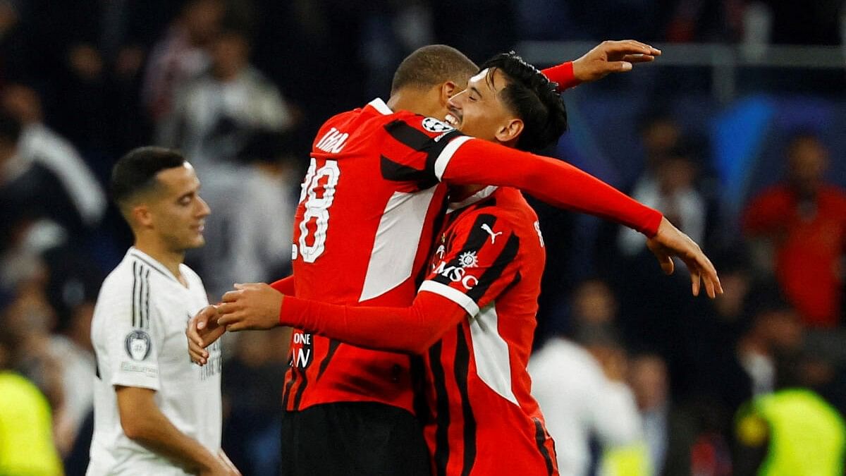 <div class="paragraphs"><p>AC Milan's Malick Thiaw and Samuel Chukwueze celebrate after the match.</p></div>