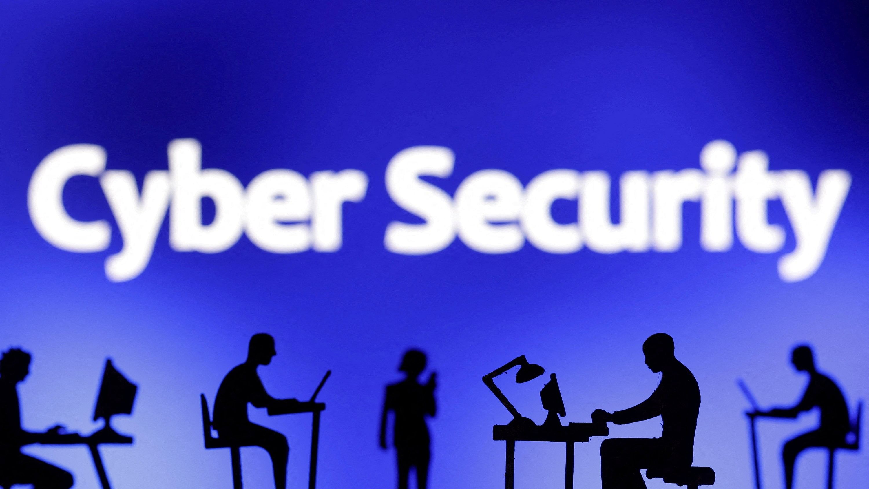 <div class="paragraphs"><p> Figurines with computers and smartphones are seen in front of the words "Cyber Security" in this illustration taken.</p></div>