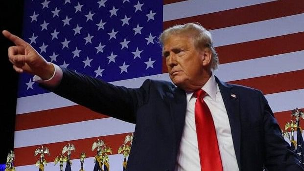 <div class="paragraphs"><p>Republican presidential nominee and former US President Donald Trump gestures as he holds hands with his wife Melania during his rally, at the Palm Beach County Convention Center in West Palm Beach, Florida, US, November 6, 2024.</p></div>