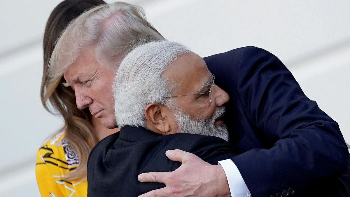 <div class="paragraphs"><p>Donald Trump and Narendra Modi seen hugging here</p></div>