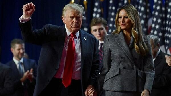 <div class="paragraphs"><p>Donald Trump with wife Melania</p></div>