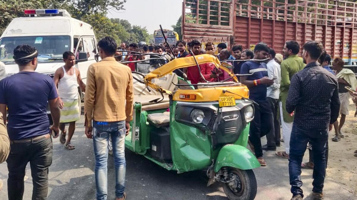 <div class="paragraphs"><p>People gather after a collision between a truck and an autorickshaw in Hardoi on Wednesday.</p></div>