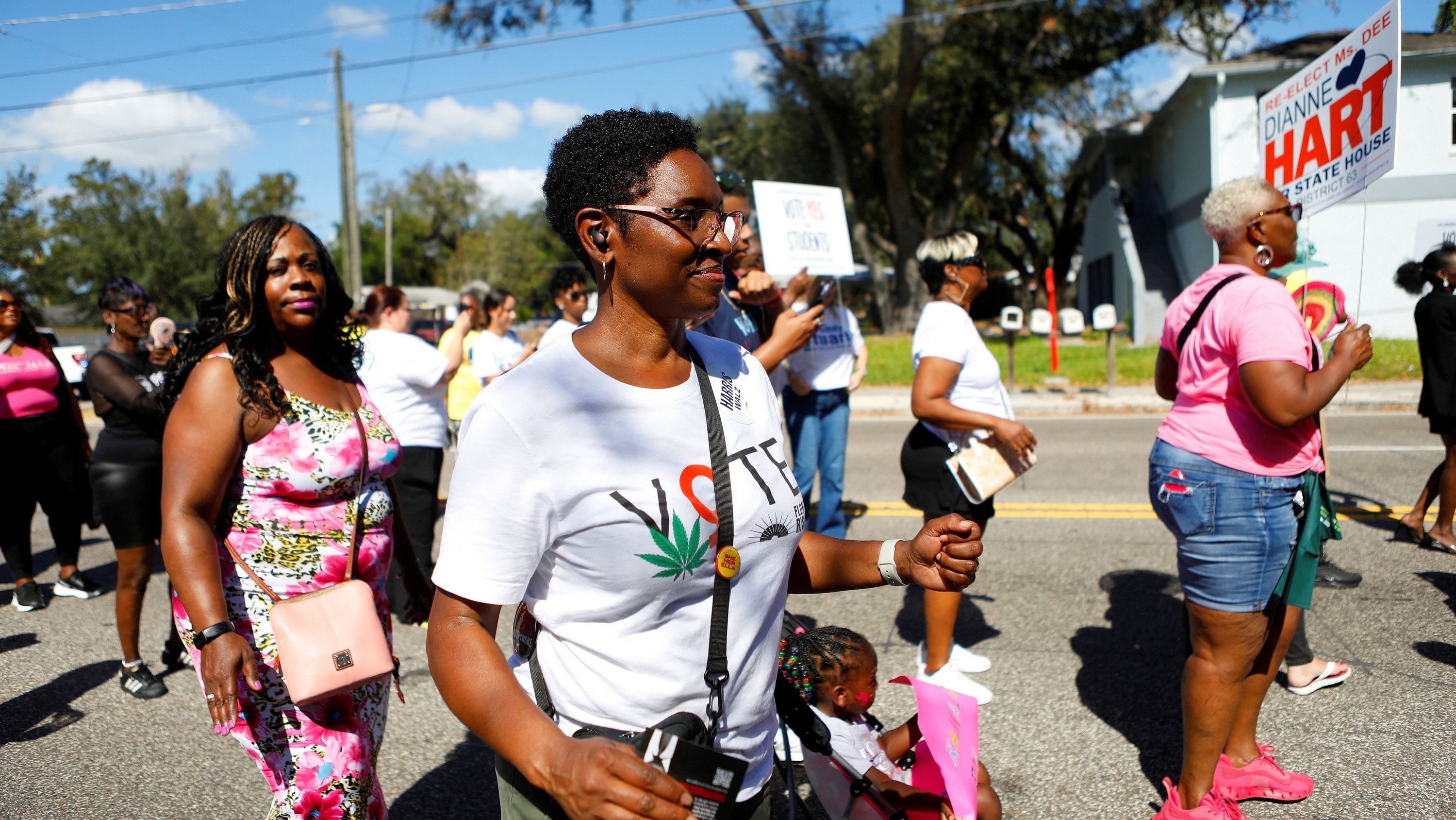 <div class="paragraphs"><p>African American women walk during national elections in Tampa, Florida, US, November 2, 2024. </p></div>