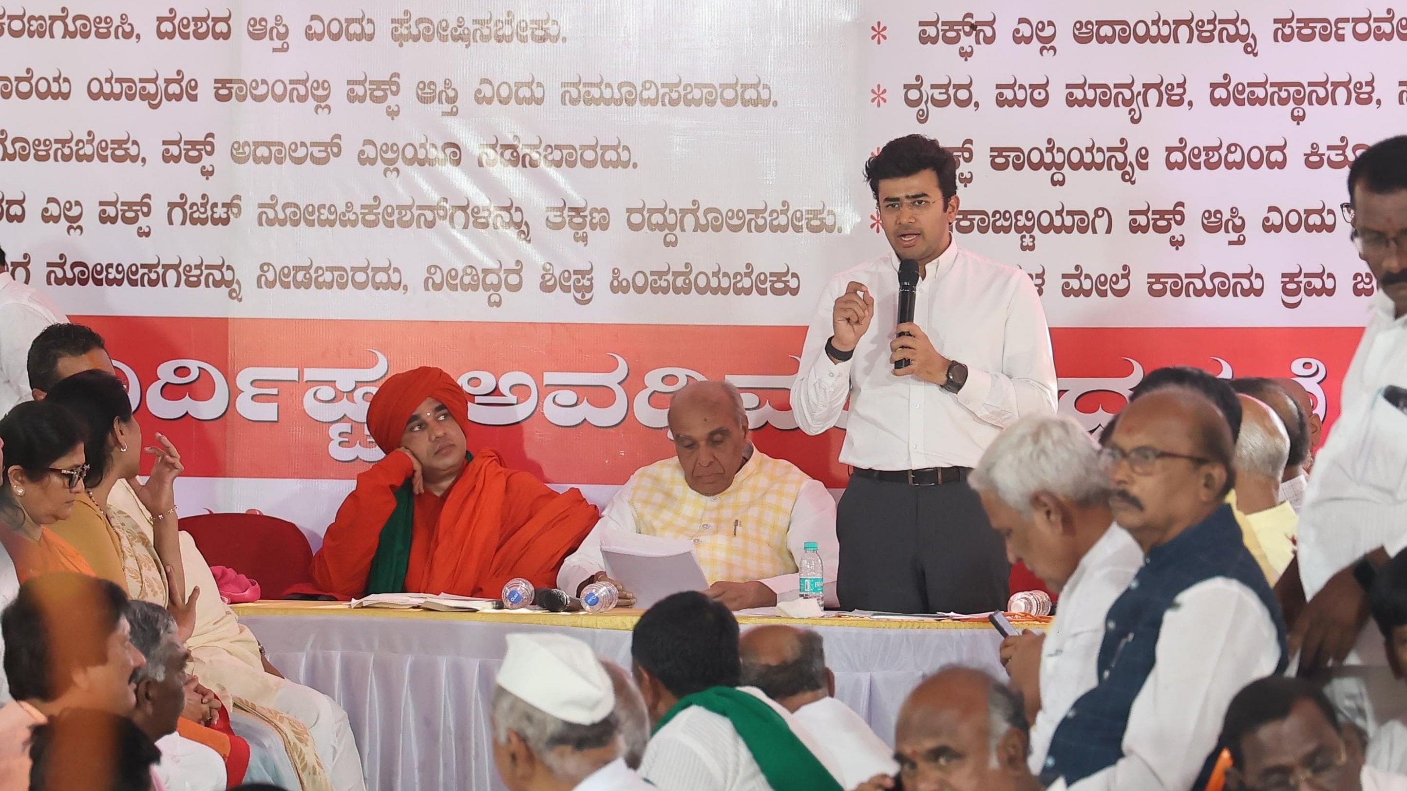 <div class="paragraphs"><p>Tejasvi Surya addresses the gathering with Jagdambika Pal (centre).&nbsp;</p></div>