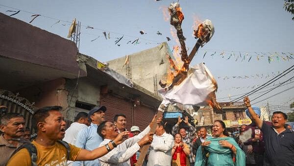 <div class="paragraphs"><p>Members from the Gorkha community burn an effigy during a demonstration against the restoration of Articles 370 and 35A.</p></div>