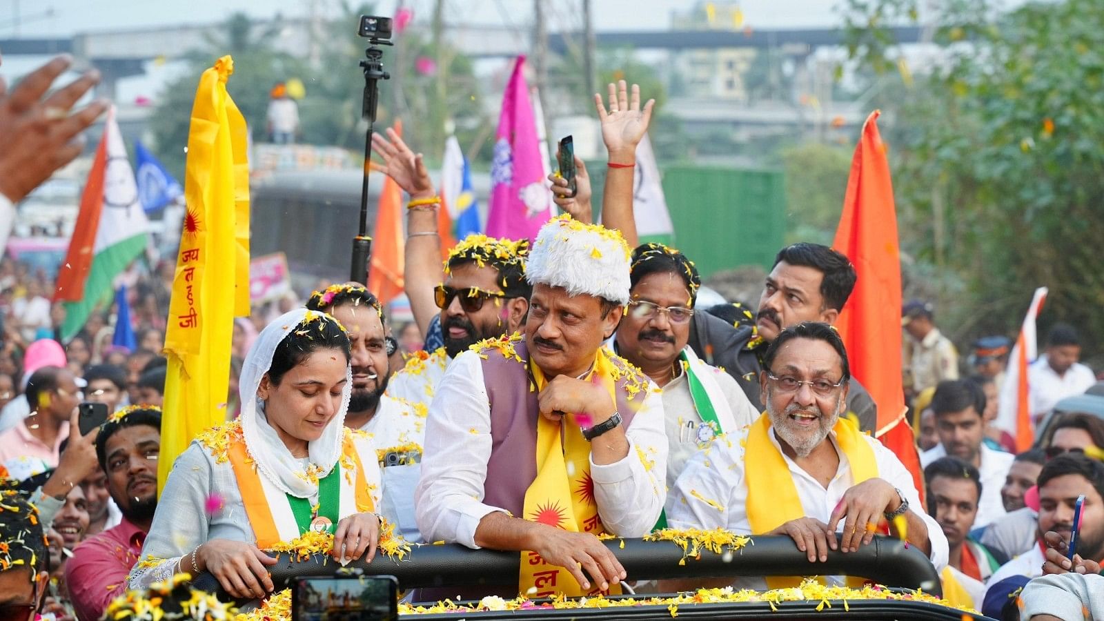 <div class="paragraphs"><p>Ajit Pawar during campaign roadshows of Nawab Malik and his daughter Sana Malik.</p></div>