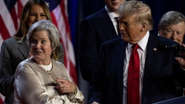 <div class="paragraphs"><p>Republican presidential nominee and former US President Donald Trump shakes hands with his senior advisor Susie Wiles</p></div>