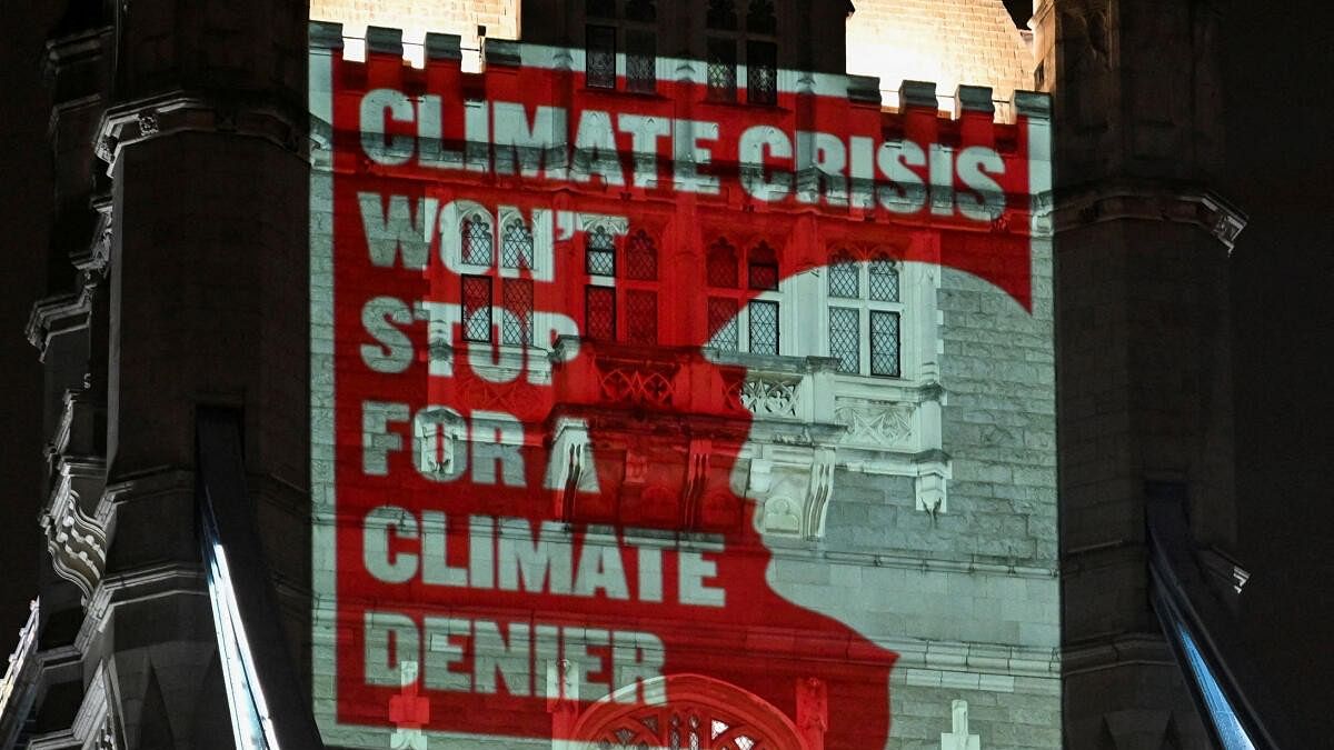 <div class="paragraphs"><p>Climate activists project a message onto Tower Bridge ahead of COP29 climate talks, in London</p></div>