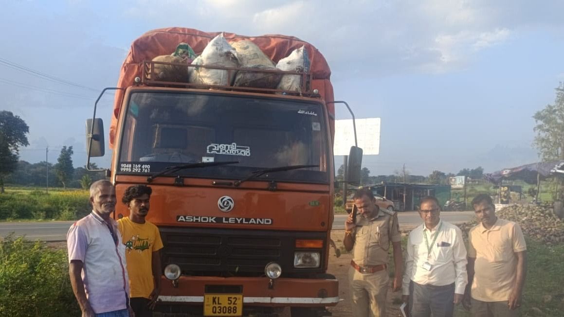 <div class="paragraphs"><p>Environment officers and police beside a truck seized off Mulehole checkpost near Gundlupet, Chamarajanagar.</p></div>