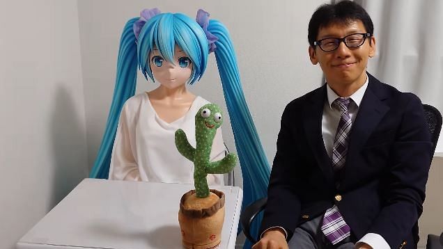 <div class="paragraphs"><p>Screengran from a video showing Japan's Akihiko Kondo (right) celebrating his 6th wedding anniversary with fictitious vocaloid 'wife' named Hatsune Miku.</p></div>