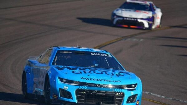 <div class="paragraphs"><p>ASCAR Cup Series driver Daniel Suarez (99) drives ahead of driver Denny Hamlin (11) during practice for the Cup Series Championship at Phoenix Raceway.</p></div>