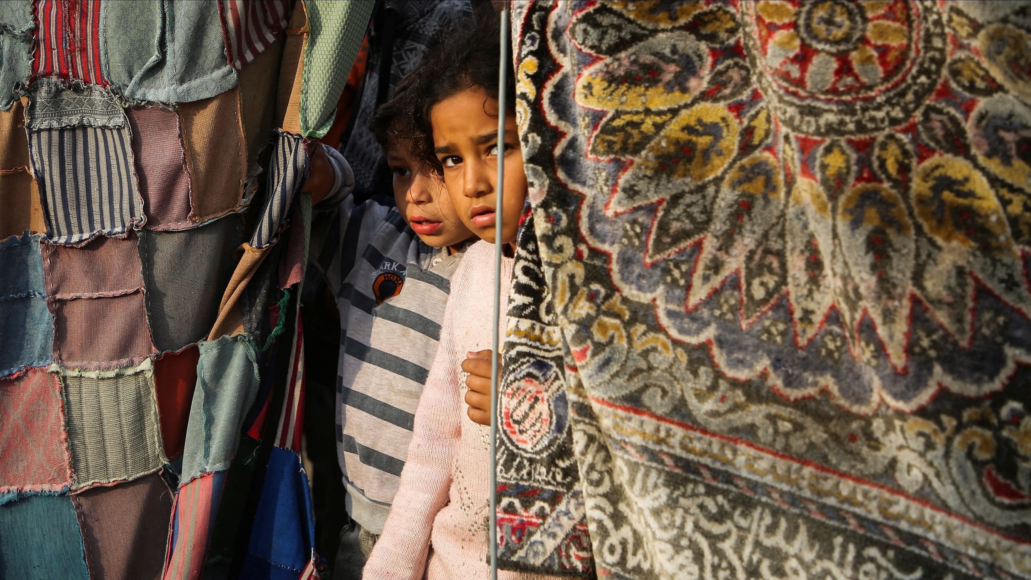 <div class="paragraphs"><p>Palestinian children stand at the site of an Israeli strike on a tent housing displaced people, in Khan Younis in the southern Gaza Strip November 9.</p></div>