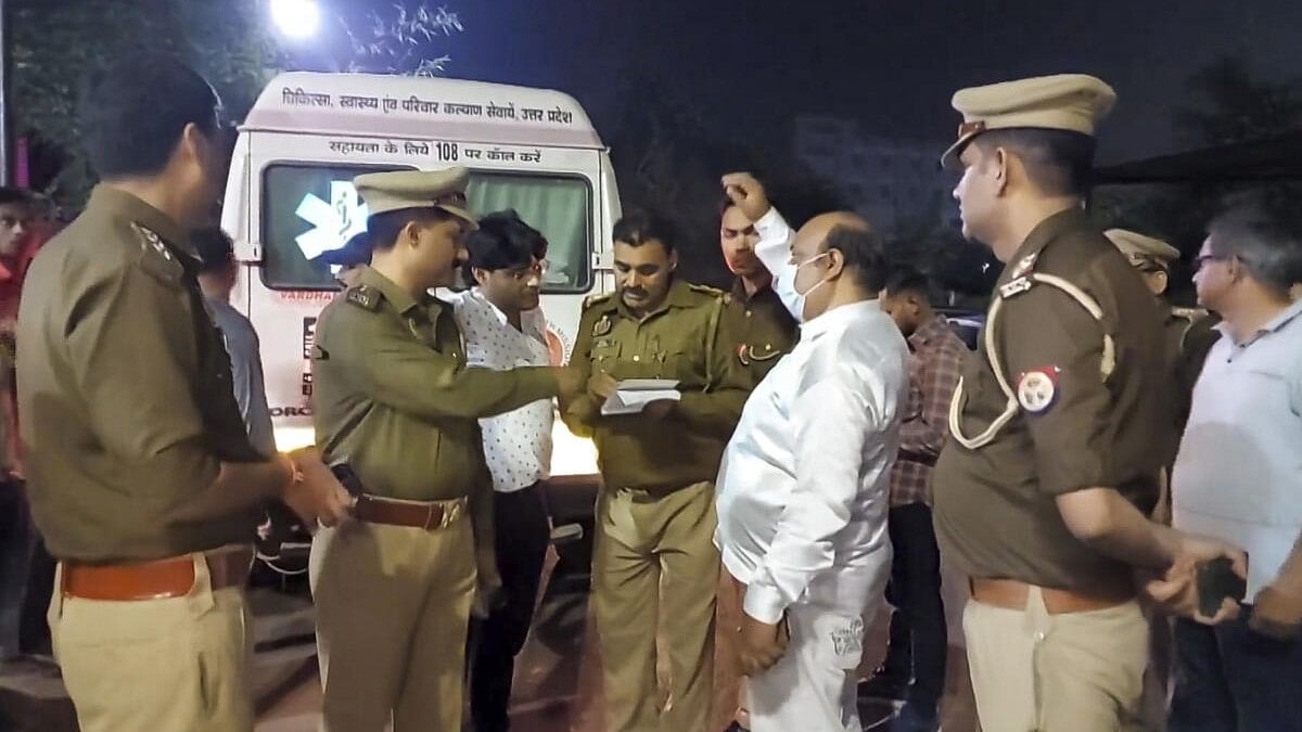 <div class="paragraphs"><p>Police personnel investigate after a tempo traveller rammed into a parked vehicle on the Agra-Lucknow Expressway, in Firozabad, Uttar Pradesh.</p></div>