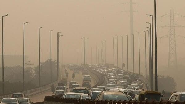 <div class="paragraphs"><p>Vehicles drive on a highway on a polluted smoggy morning in New Delhi.</p></div>