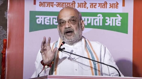 <div class="paragraphs"><p>Union Minister and senior BJP leader Amit Shah speaks at the release of the BJP's Sankalp Patra for Maharashtra Assembly elections, in Mumbai, Sunday, Nov. 10, 2024.</p></div>